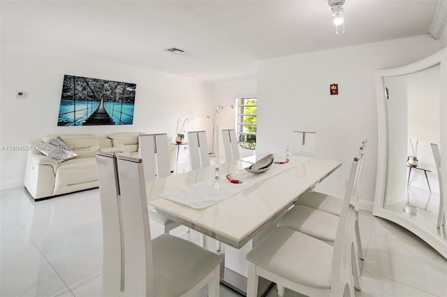 12411 SW 12th St, Davie, FL 33325 - dining space with light tile patterned floors and baseboards