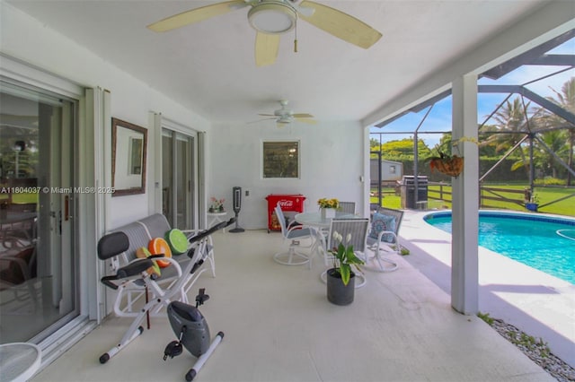 12411 SW 12th St, Davie, FL 33325 - swimming pool featuring ceiling fan, a patio area, glass enclosure, and a lawn