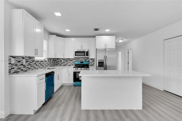 8330 NW 35th Pl, Miami, FL 33147 - kitchen featuring appliances with stainless steel finishes, light wood finished floors, a sink, light countertops, and tasteful backsplash