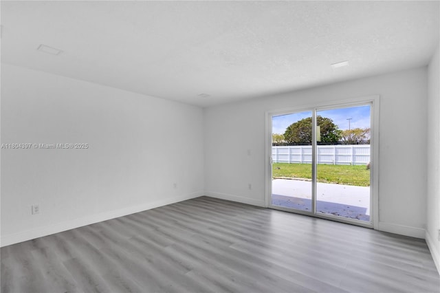 8330 NW 35th Pl, Miami, FL 33147 - unfurnished room with wood finished floors and baseboards