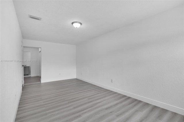 8330 NW 35th Pl, Miami, FL 33147 - unfurnished room with wood finished floors and baseboards
