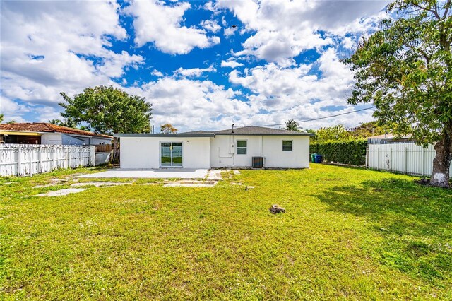 8330 NW 35th Pl, Miami, FL 33147 - back of house featuring a patio, central air condition unit, and stucco siding