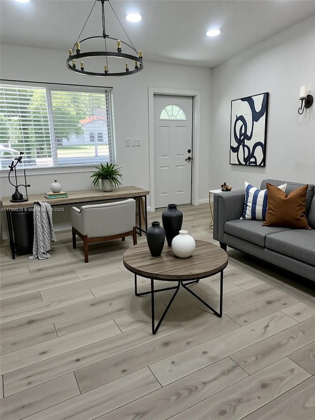 16204 NE 18th Ct, North Miami Beach, FL 33162 - living room featuring light wood finished floors, recessed lighting, plenty of natural light, a chandelier, and baseboards