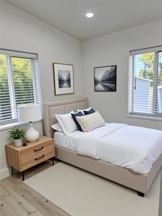 16204 NE 18th Ct, North Miami Beach, FL 33162 - bedroom featuring light wood-type flooring, multiple windows, baseboards, and recessed lighting