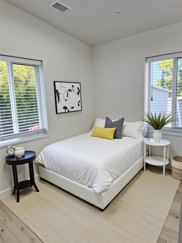 16204 NE 18th Ct, North Miami Beach, FL 33162 - bedroom featuring light wood finished floors and baseboards