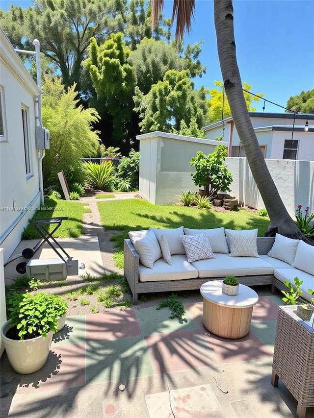 16204 NE 18th Ct, North Miami Beach, FL 33162 - view of patio with an outdoor hangout area, a fenced backyard, an outbuilding, and a storage shed