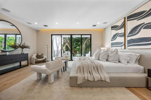 2805 Freeman St, Miami, FL 33133 - bedroom featuring light wood finished floors, multiple windows, recessed lighting, and access to exterior