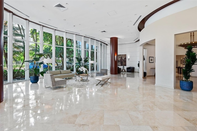 2475 Brickell Ave Unit 1805, Miami, FL 33129 - common area featuring a towering ceiling and expansive windows