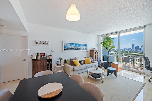 2475 Brickell Ave Unit 1805, Miami, FL 33129 - living area with floor to ceiling windows, a view of skyline, and a textured ceiling
