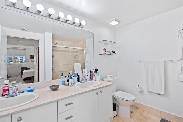 2475 Brickell Ave Unit 1805, Miami, FL 33129 - bathroom with a stall shower, toilet, double vanity, connected bathroom, and tile patterned flooring