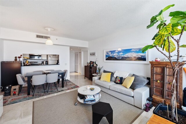 2475 Brickell Ave Unit 1805, Miami, FL 33129 - living room with a textured ceiling
