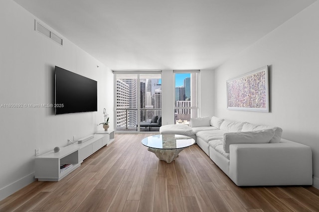244 Biscayne Blvd Unit 2407, Miami, FL 33132 - living room with wood finished floors and floor to ceiling windows