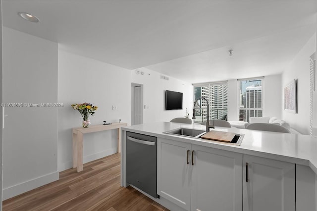 244 Biscayne Blvd Unit 2407, Miami, FL 33132 - kitchen featuring stainless steel dishwasher, open floor plan, light countertops, and recessed lighting