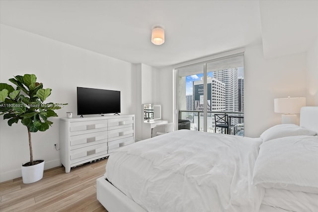 244 Biscayne Blvd Unit 2407, Miami, FL 33132 - bedroom featuring access to exterior and light wood finished floors