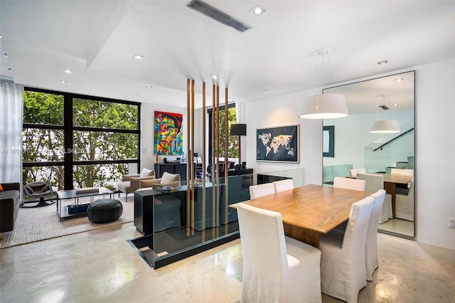 1024 Lenox Ave Unit 8, Miami Beach, FL 33139 - dining area with healthy amount of natural light, floor to ceiling windows, recessed lighting, concrete floors, and stairway