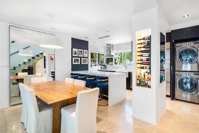 1024 Lenox Ave Unit 8, Miami Beach, FL 33139 - dining room featuring stacked washer / drying machine and stairs