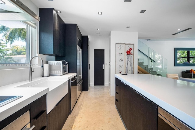 1024 Lenox Ave Unit 8, Miami Beach, FL 33139 - kitchen with light countertops, dishwasher, modern cabinets, dark cabinetry, and recessed lighting