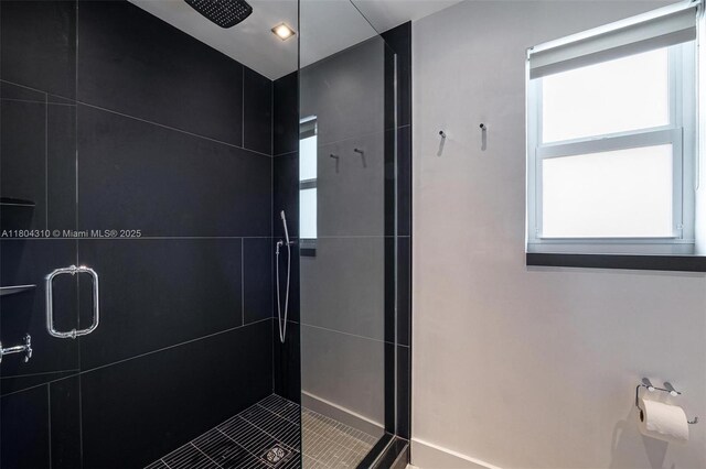 1024 Lenox Ave Unit 8, Miami Beach, FL 33139 - full bath featuring a shower stall, tile patterned flooring, and baseboards