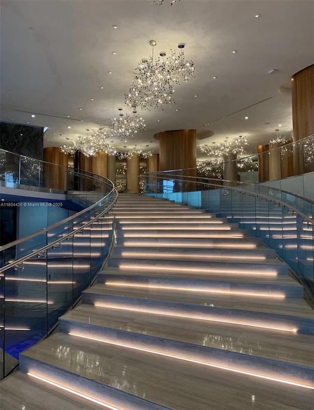 488 NE 18th Unit 2703, Miami, FL 33132 - staircase featuring a chandelier
