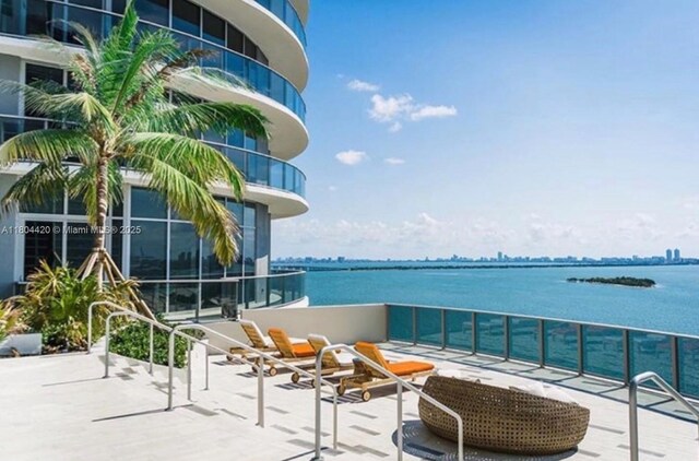 488 NE 18th Unit 2703, Miami, FL 33132 - balcony featuring a water view and a patio area