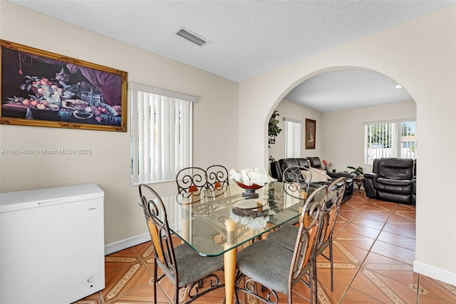 30701 SW 156th Ave, Homestead, FL 33033 - tiled dining area with arched walkways and baseboards