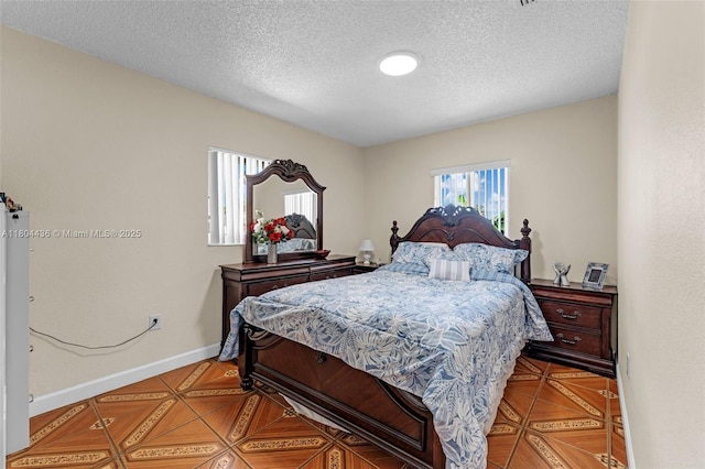 30701 SW 156th Ave, Homestead, FL 33033 - tiled bedroom with a textured ceiling and baseboards