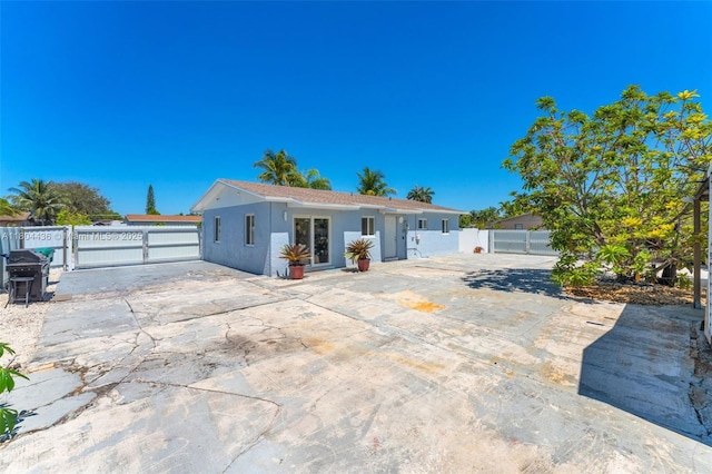 30701 SW 156th Ave, Homestead, FL 33033 - rear view of property with a gate, fence, stucco siding, and a patio area