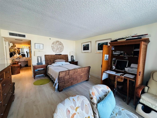 4750 S Ocean Blvd Unit 401, Highland Beach, FL 33487 - bedroom with wood finished floors and a textured ceiling