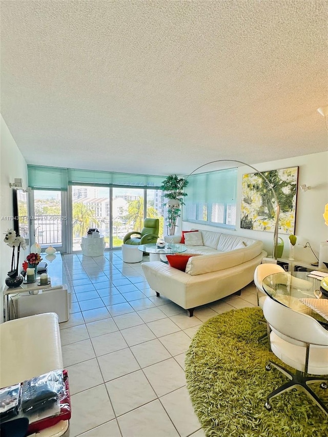 4750 S Ocean Blvd Unit 401, Highland Beach, FL 33487 - living room featuring light tile patterned floors and a textured ceiling
