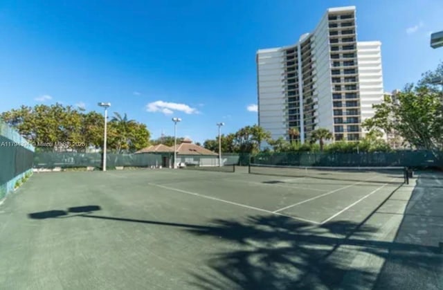 4750 S Ocean Blvd Unit 401, Highland Beach, FL 33487 - view of tennis court with fence