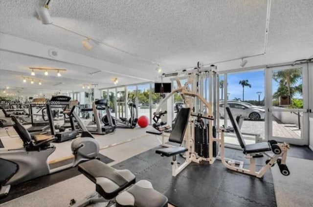 4750 S Ocean Blvd Unit 401, Highland Beach, FL 33487 - exercise room with a textured ceiling