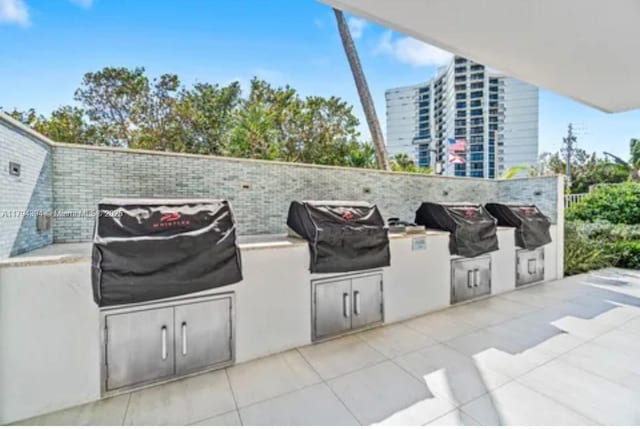4750 S Ocean Blvd Unit 401, Highland Beach, FL 33487 - view of patio / terrace with an outdoor kitchen and grilling area