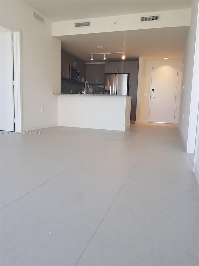 5350 NW 84th Ave Unit 1018, Doral, FL 33166 - unfurnished living room featuring a sink and concrete flooring