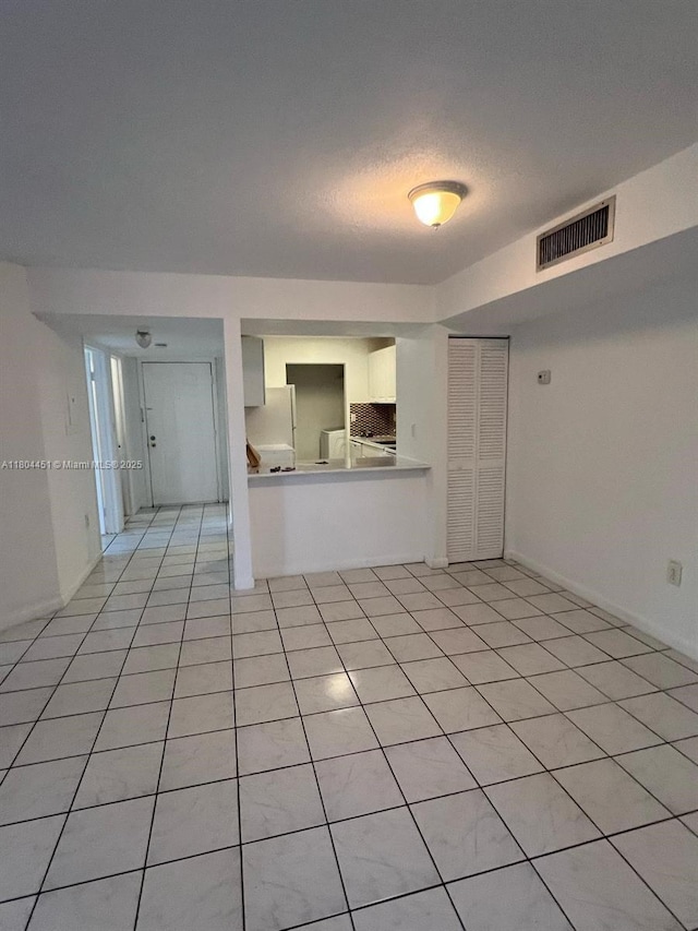 927 NE 199th St Unit 102, Miami, FL 33179 - unfurnished living room with light tile patterned flooring