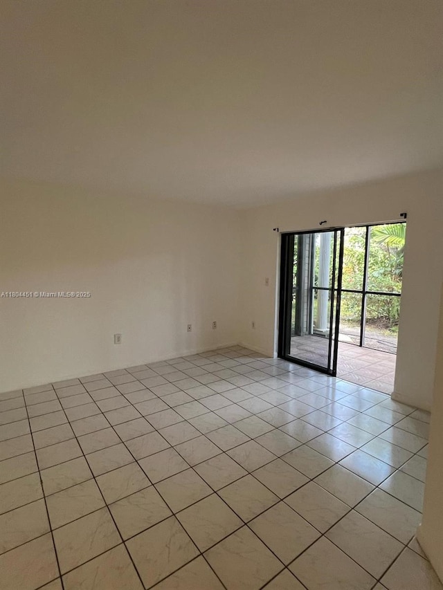 927 NE 199th St Unit 102, Miami, FL 33179 - unfurnished room with light tile patterned flooring