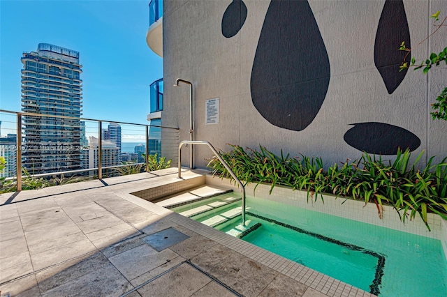 801 S Miami Ave Unit 1207, Miami, FL 33130 - view of swimming pool with a hot tub and a city view