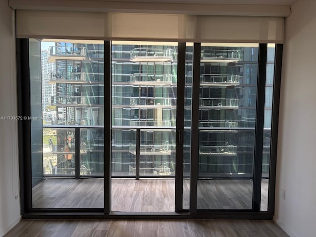 801 S Miami Ave Unit 1207, Miami, FL 33130 - doorway featuring wood finished floors and baseboards