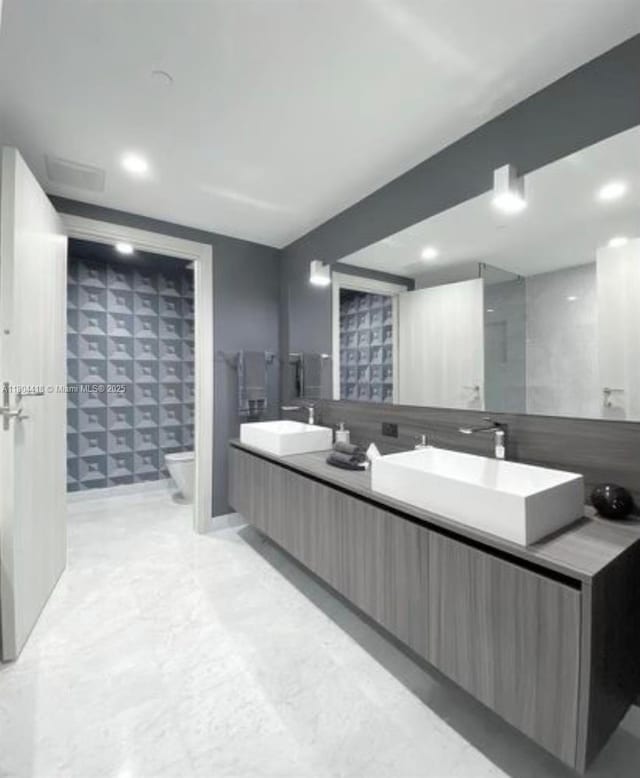 1000 Brickell Plz Unit 3308, Miami, FL 33131 - full bath with toilet, double vanity, and recessed lighting