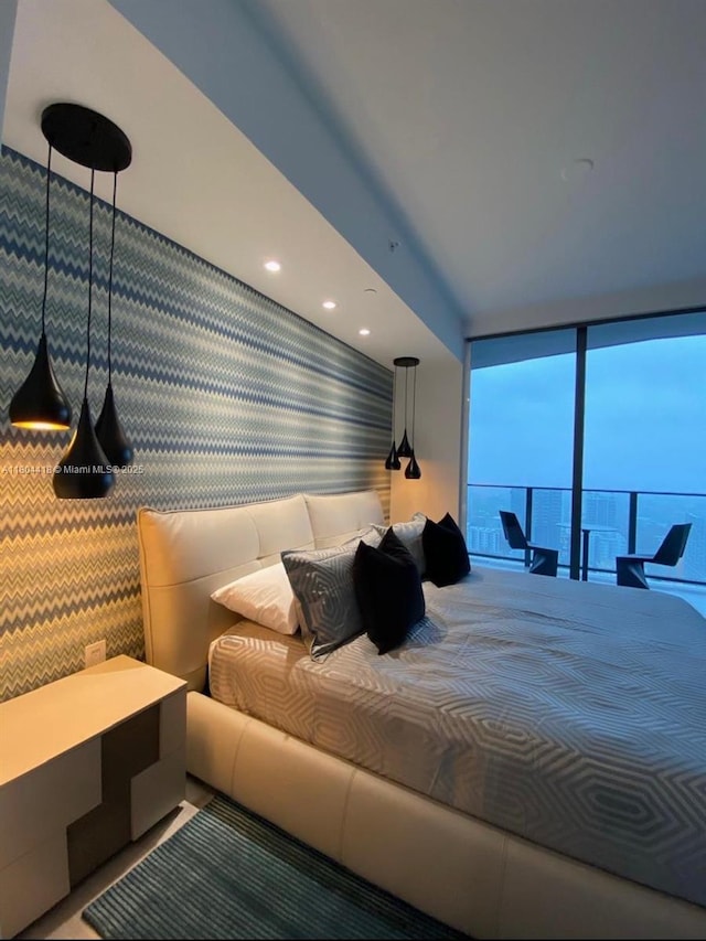 1000 Brickell Plz Unit 3308, Miami, FL 33131 - bedroom with a wall of windows and wallpapered walls