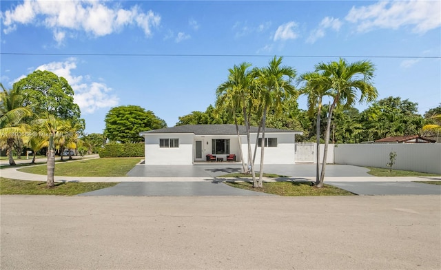 4301 SW 85th Ave, Miami, FL 33155 - view of front of house with fence, stucco siding, and a gate