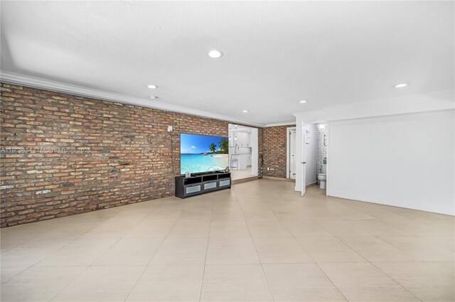 4301 SW 85th Ave, Miami, FL 33155 - unfurnished living room featuring crown molding, brick wall, and recessed lighting