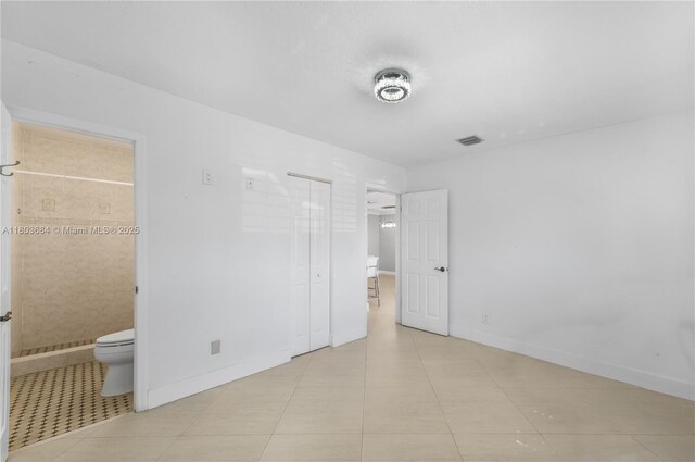 4301 SW 85th Ave, Miami, FL 33155 - bathroom featuring a textured wall, a tile shower, vanity, and toilet