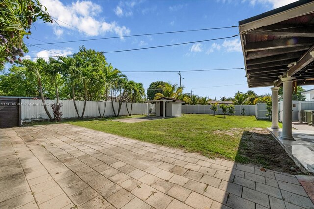 4301 SW 85th Ave, Miami, FL 33155 - view of patio with an outdoor structure and a shed