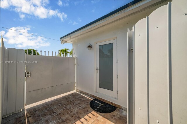4301 SW 85th Ave, Miami, FL 33155 - view of exterior entry featuring a gate and stucco siding