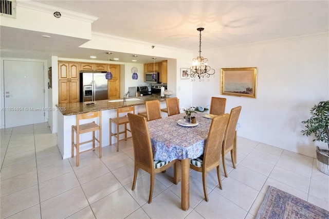 2555 Collins Ave Unit 308, Miami Beach, FL 33140 - dining room with light tile patterned flooring, a chandelier, ornamental molding, and recessed lighting