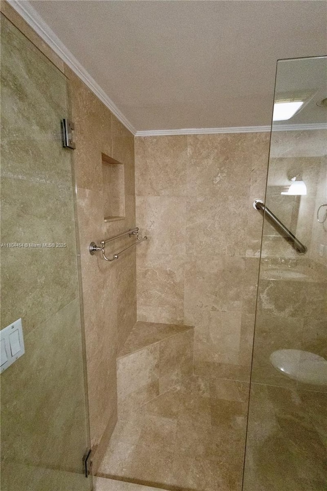 2555 Collins Ave Unit 308, Miami Beach, FL 33140 - bathroom with crown molding and tiled shower