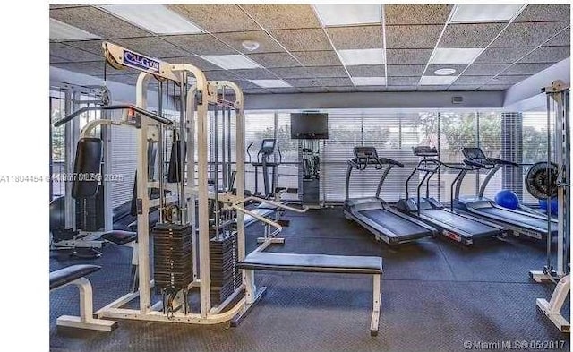 2555 Collins Ave Unit 308, Miami Beach, FL 33140 - gym with a paneled ceiling