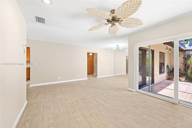 2717 N Carambola Cir N Unit 17101, Coconut Creek, FL 33066 - spare room with light wood-type flooring, a ceiling fan, and baseboards