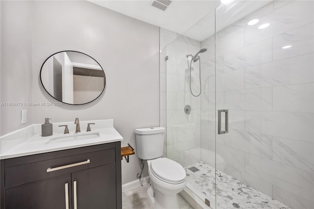 2717 N Carambola Cir N Unit 17101, Coconut Creek, FL 33066 - full bath with a stall shower, toilet, vanity, baseboards, and tile patterned flooring