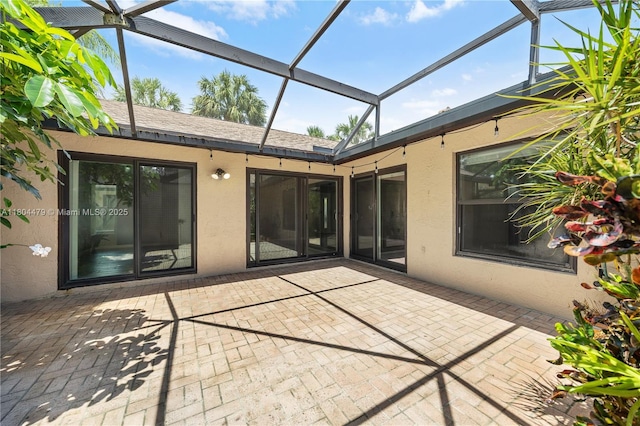 2717 N Carambola Cir N Unit 17101, Coconut Creek, FL 33066 - rear view of property with stucco siding, a lanai, and a patio